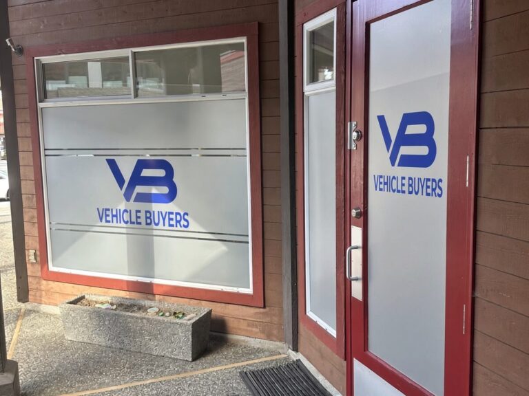 Vehicle Buyers office at 3747 Delbrook Ave, North Vancouver – look for the red door